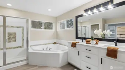 Spa-inspired 5-piece ensuite with separate shower and deep soaking tub.