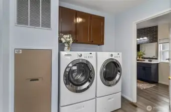 Laundry area with side door to exterior.