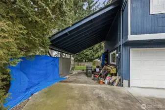 Rare covered RV and boat parking with generous driveway space.