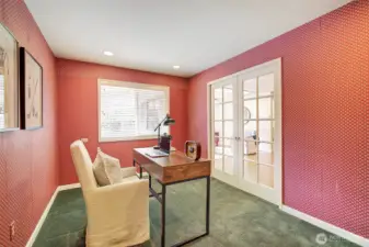 Privacy in office with glass paneled pocket doors.