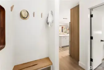 Formal entry includes seating area with easy access to the flex room