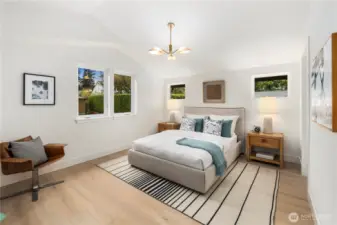 Primary suite with vaulted ceilings and great natural light