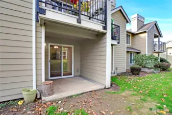 Private back patio with a large storage closet.