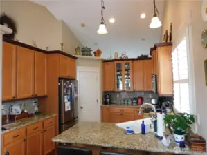 Kitchen with granite counter tops and pantry