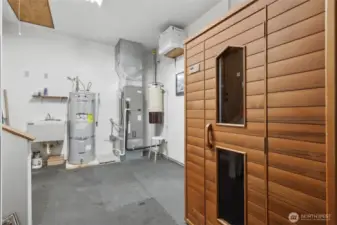 Mud room entryway from garage features sauna.