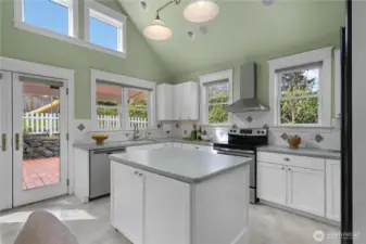 Island and well equip kitchen with French Door to entertainment-sized patio