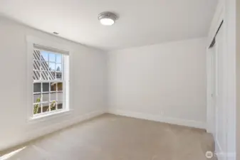 One of 2 bedrooms on the upper floor.