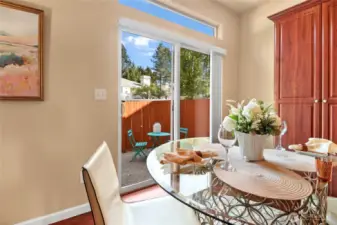 The patio door off the nook leads to the rear yard space.