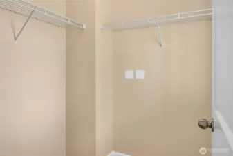 The primary bedroom offers a walk-in closet with window for natural light.