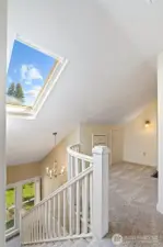 Nice landing nook with skylight and tons of storage.