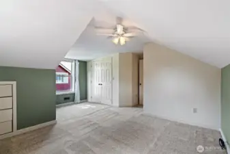 2nd floor 2nd bedroom with built in storage, fan and walk-in closet.