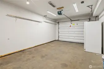 Single car garage, garage refrigerator stays.
