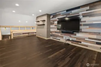 Upstairs bonus room with custom wood planked walls.  Excellent place for entertaining large groups.