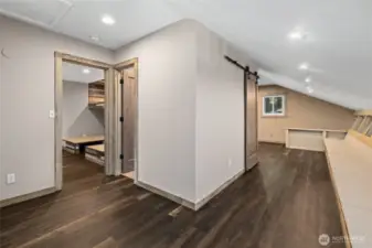 Upstairs loft area with seating and facing the bunkroom and upstairs bathroom.