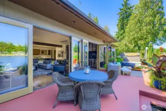 The deck runs the entire width of the home on the lake side.