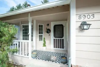 Put a comfy bench on this covered front porch and sip your coffee out here in the mornings.