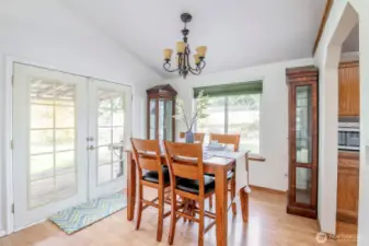 Dining room with french doors, providing access to the back deck.