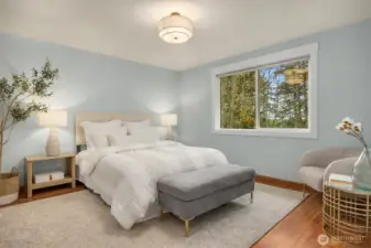 Main level primary suite with newly renovated bathroom and walk-in closet.