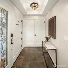 Gorgeous formal entry with Dutch door and massive entry closet! Bonus pass through in closet to garage to bring wood through on the chilliest days.