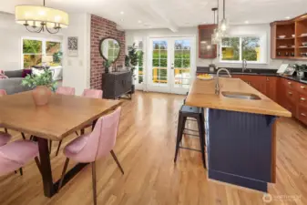 The kitchen has been remodeled and feels great. Extra seating at the bar and the previous owners had a sofa near the backside of the fireplace. So many options for how to live in this wonderful home.