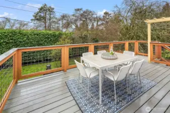 The trex deck leads to to the large and lovely yard.