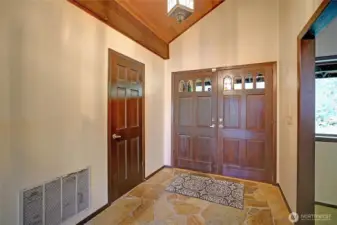 Slate entry with vaulted ceilings.
