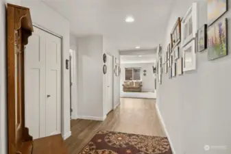 Large entry way with wide hallway leading to the back of the house where the open concept that includes living, dining and kitchen is found.