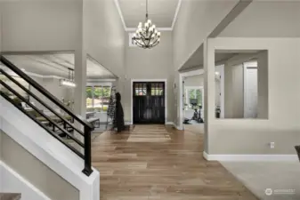 Stunning entry with a double door entry & impressive chandelier.