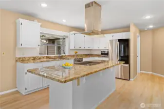 Love this warm, spacious and inviting kitchen! The galley island is perfect for bar-style seating and gathering.