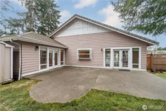 The left-wing of the house is the primary ensuite. The French doors on the right lead into the dining area.