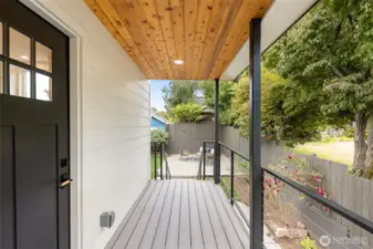 Enjoy coffee or cocktails on this charming private deck off the kitchen