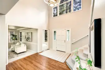 Step into a warm, inviting home where sunlight dances across refinished hardwood floors.