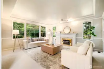 The formal living room exudes elegance and comfort, perfect for intimate gatherings or quiet reflection with a favorite book.