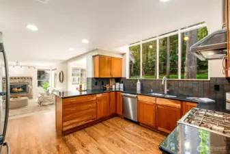 The chef’s kitchen is a masterpiece, with granite countertops, custom Shaker cherry cabinetry, and stainless steel appliances.