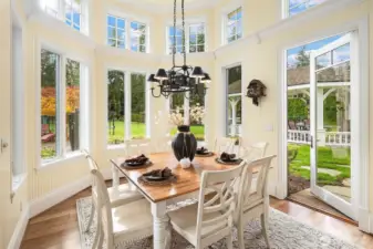 Spacious Breakfast nook with access to a covered outdoor living space with commercial size pizza oven and tremendous seating space