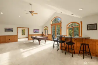 Tremendous space offers a massive game/bonus room with exterior access door to pool area plus additional bonus room adjoining conveniently located in the additional bedroom wing area.