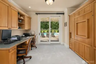Additional main floor office with slider to pool area