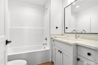 Downstairs you will find 2 bedrooms and 2 bathrooms.