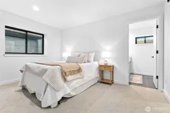 Primary bedroom has an attached bathroom suite.