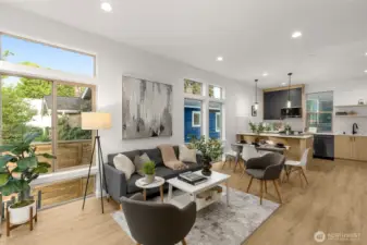 The open living room flows seamlessly for both relaxation and entertaining, enhanced by expansive glass and tree-lined outlooks.