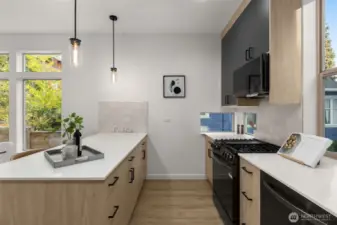 This kitchen view highlights clean lines, modern appliances, and an abundance of workspace.