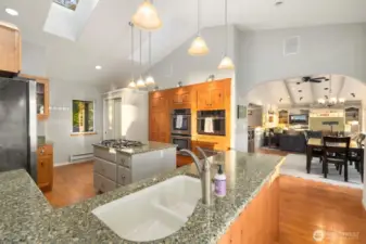 Chef-inspired kitchen featuring granite surfaces, generous cabinetry, and an island layout designed for effortless hosting.