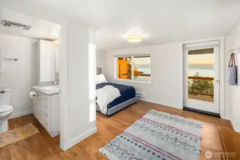 Light-filled bedroom opening to outdoor space—perfect for enjoying fresh ocean air and coastal scenery.