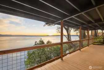 Sheltered entertaining space overlooking open water—perfect for year-round relaxation, sunset dining, and peaceful island mornings.