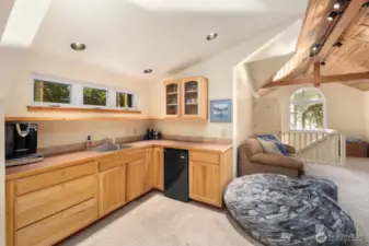 Well-equipped kitchenette with custom cabinetry and workspace—ideal for guests, extended stays, or creative studio use.