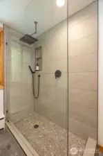 Spacious main floor bathroom shower.
