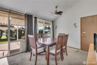 The dining area has large windows and direct access to outdoor patio. There is plenty of room for large gatherings.