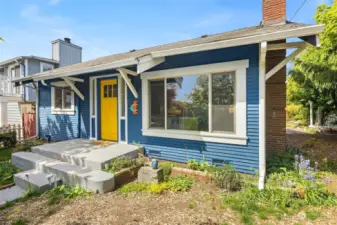 Welcome to your charming, light-filled bungalow that exudes old-world charm with modern comforts, on a large, corner lot in the desirable Greenwood neighborhood