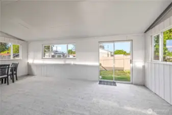 Covered Patio Space with Finished Carpet, great for entertaining guests and throwing parties.