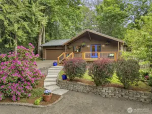 Tucked away on nearly a half acre sits this cabinesque charmer!